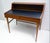 1960s Danish Desk. Made of wood with two drawers at the front, a scratch-resistant black top and a storage compartment....