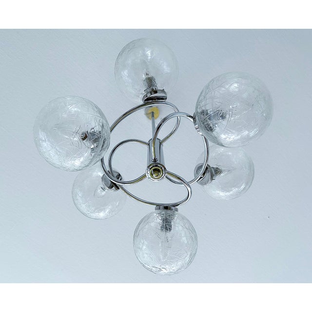 Mid century pendant light, chrome structure with intertwined curved chromed spokes and bubble glass shades height 31.49...