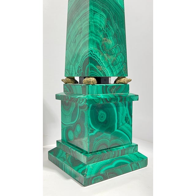 Exceptional antique (late 19th century) garniture including mantel clock and Egyptian style obelisks with malachite stone...