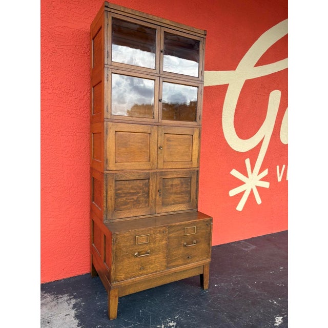 Mission style stacking oak bookcase with a double filing cabinet. The cabinets are modular and can stack as your...
