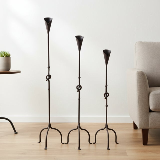 The Conic Knot Trio: Floor Candelabra Set ️ Add a touch of architectural elegance to your home. This Hand-Forged Iron Set...