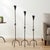 The Conic Knot Trio: Floor Candelabra Set ️ Add a touch of architectural elegance to your home. This Hand-Forged Iron Set...