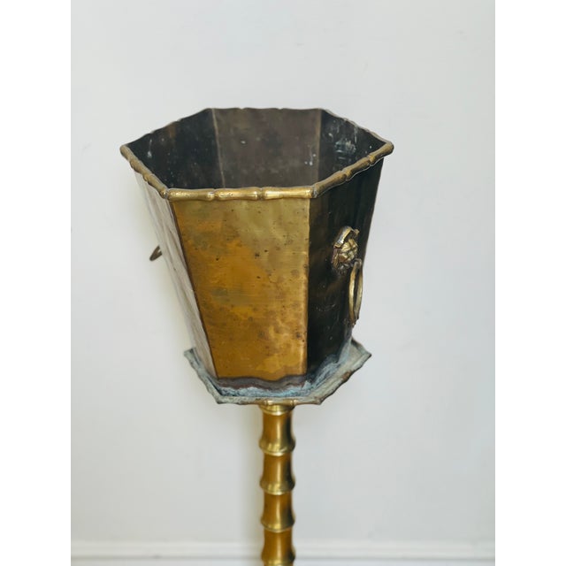 Vintage brass planter octagonal shape with lion head handles, on brass stand. Oxidized at bottom.