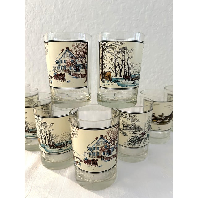 Lovely set of eleven clear holiday tumblers with various Currier & Ives winter scenes. Thick glass bases. All in excellent...