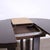 The table features a solid structure, with elegant metal details along the base. It opens easily and is extendable....
