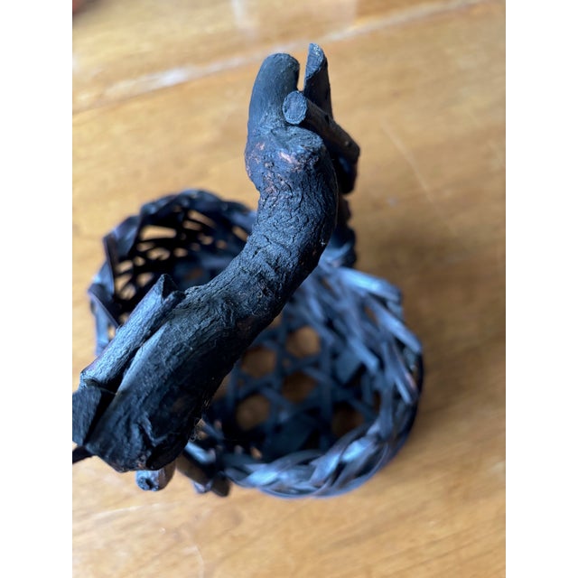 Key points: Natural gnarled branch handle with original knots and bark texture Dark smoked bamboo strips with deep...