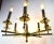 Stylish brass spoke style hanging fixture, in original and working condition. The chandelier shows some cosmetic wear to...