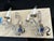 Custom two-arm Dennis & Leen sconces featuring a clear beaded frame and an antique silver leaf finish. Designed with...