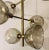 Stylish Arteriors Modern Brass Finished Norwich Chandelier, Smokey textured glass shades, showroom floor sample