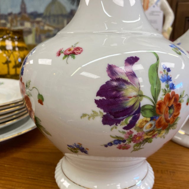 Pair of white porcelain vases. With floral details and gold rims. Bareuther Bavarian porcelain.