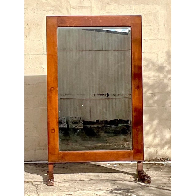 A stunning vintage Boho floor mirror. A chic stained oak from with a beautiful patina from time. Handsome carved feet make...