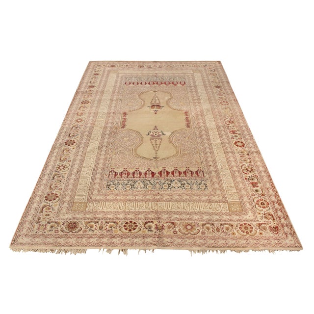 A hand-knotted marvel originating from Turkey circa 1920-1930, this antique 6x9 Ghiordes rug is skillfully crafted in a...