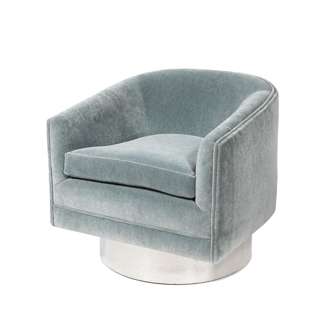 A spectacular pair of Mid-Century Modernist swivel club chairs, designed by Leon Rosen for Pace, featuring sleek polished...