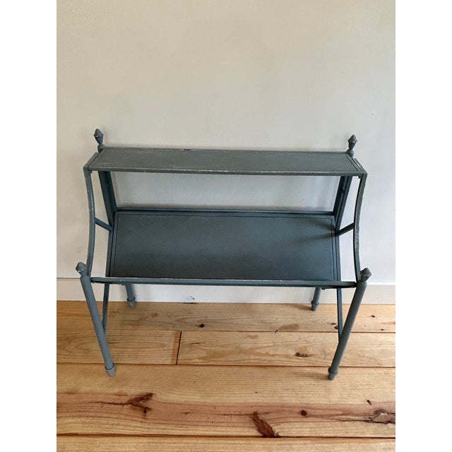 1920’s booksellers fully collapsable metal easel stand. Lovely grey blue paint. Pineapple finials. Great form.