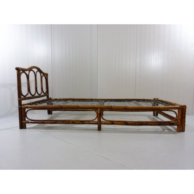 Lovely bed or daybed in bamboo and rattan. For a guest room but also nice outdoors beneath a roof or in the garden house....