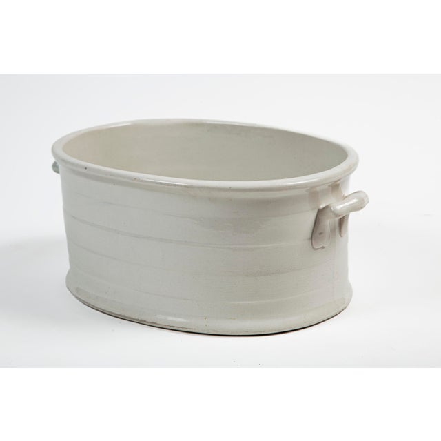 Antique White Ironstone Footbath, England, circa 1910. Oval shape with raised ribbing and two applied handles. Lovely...