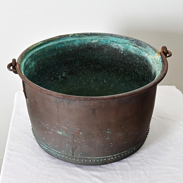 A massive antique French copper cooking pot, from circa 1880. The interior is oxidized, developing a beautiful verdigris...