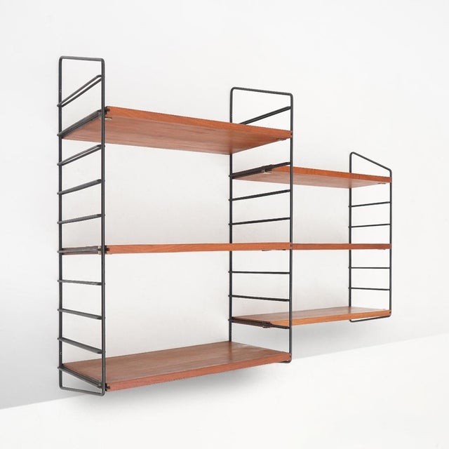 Italian wall-mounted bookcase from the 1960s, embodying a functional and rational design approach in which structural...