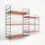 Italian wall-mounted bookcase from the 1960s, embodying a functional and rational design approach in which structural...