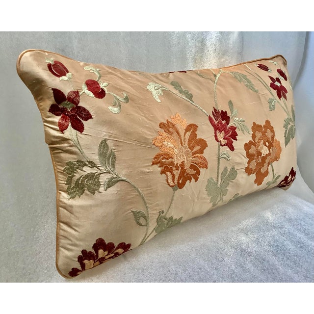 This Garden Floral Embroidered Silk Lumbar Decorative Pillow Cover by Sethi & Sethi features a beautiful floral pattern in...
