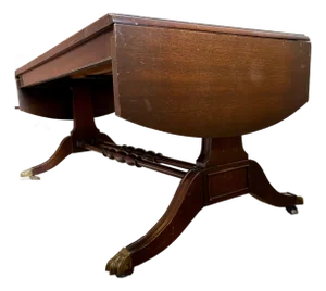 Vintage Dark Wood Coffee Table With Brass Claw Wheels