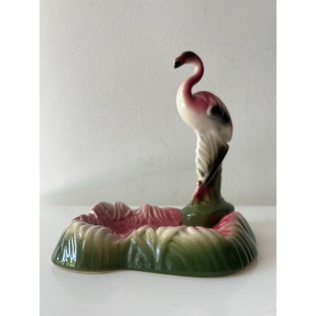 Retro mid-century, ceramic pink and green flamingo figure in a pool/tray/ decorative bowl (possibly an ashtray for that...