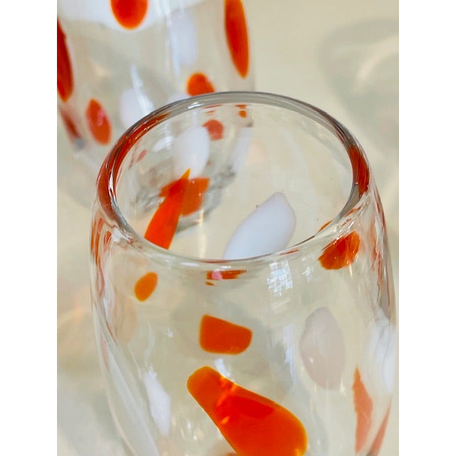 Set of 12 stunning and individually handblown mid-century modern glasses. Each glass is unique and has slight variations...