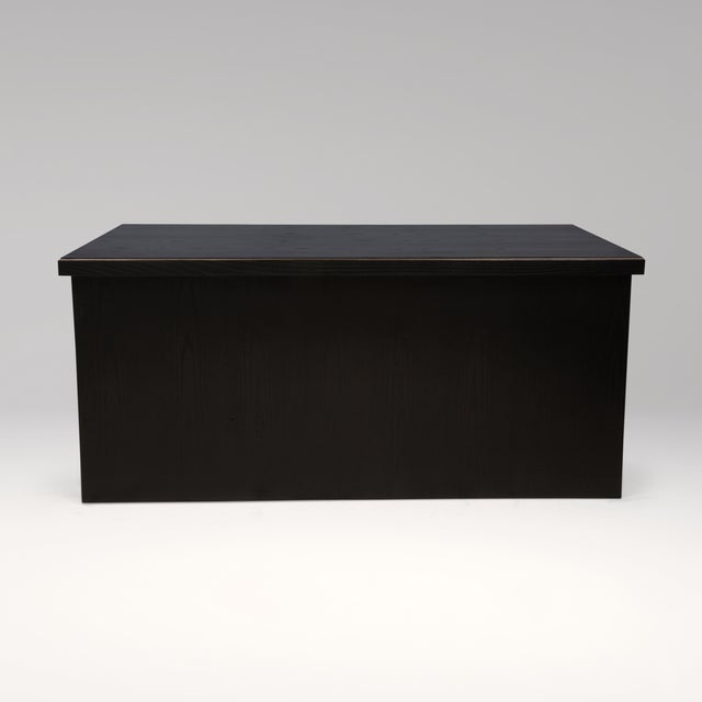 The Desk in Black Oak with Brass Details by R&Y Augousti is a striking expression of architectural elegance. Crafted in...