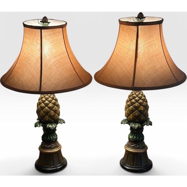 Vintage Hollywood Regency Painted Composition Pineapple Lamps - A Pair Infuse your home decor with a lively sense of...