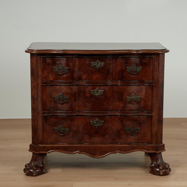 Handsome 19th century Dutch commode handcrafted in burled walnut featuring a dramatic tortoise shell like book matched top...