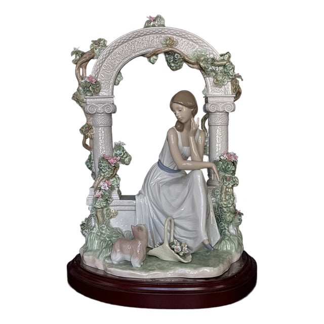 Lladró Tranquility (Model #06677) Porcelain Figurine, Featuring a Seated Woman Under a Floral Arbor For Sale