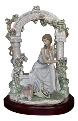 Lladró Tranquility (Model #06677) Porcelain Figurine, Featuring a Seated Woman Under a Floral Arbor