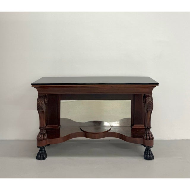 A distinguished Ralph Lauren console table that blends classical craftsmanship with the brand’s signature equestrian-...