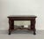 A distinguished Ralph Lauren console table that blends classical craftsmanship with the brand’s signature equestrian-...