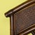 A fretwork rattan king headboard, its open geometric fretwork spreading across a grand eighty-one-inch width. The woven...