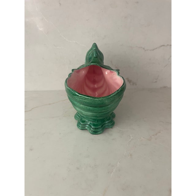 This beautiful ceramic nautilus shell has a lovely green exterior with shell pink interior. It's a great shape which could...