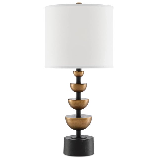 Our Chastain Table Lamp fuses round shapes with flat planes and gleaming surfaces with matte darkness. Made of cast...