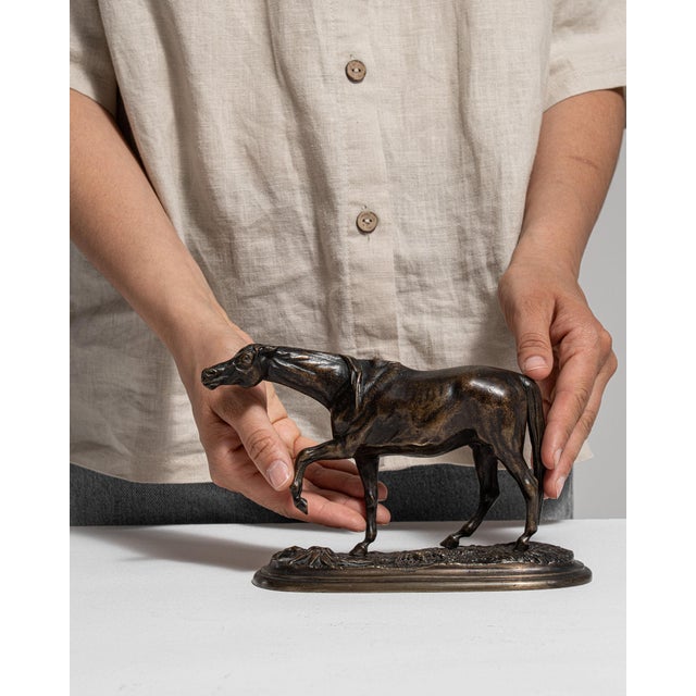 This 19th century sculpture from France is finished in brass, worked in bronze. Its form follows honest, well-proportioned...