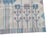 Hand-woven wool tapestry rug in shades of blue, featuring stylized birds and flowers (organic-geometric style). The...