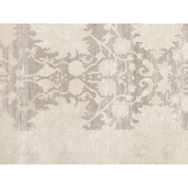 This Vintage Egyptian Tabriz Rug is meticulously hand-woven with wool on a cotton foundation in the Nile Delta region of...