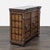 This cabinet features a rich wood finish with detailed metal accents and decorative handles. It has two front doors that...