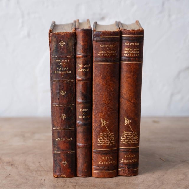 A handsome grouping of four Swedish books bound in tooled leather with marbled paper boards, drawn from an early-...