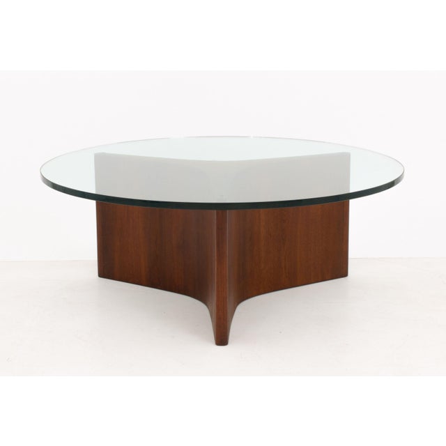 Danish Modern Walnut Coffee Table, with circular glass top above triangular base. 16.5" H x 42" Diameter. Provenance: From...