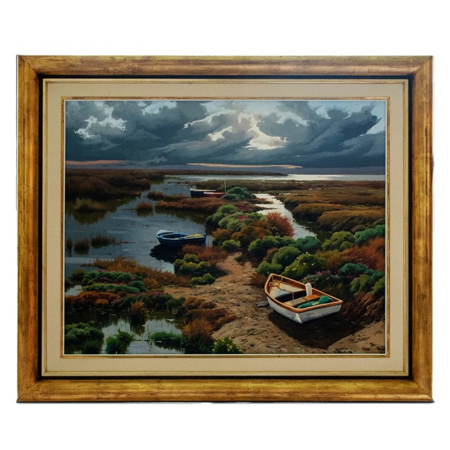 Boats on the Marsh is an original signed oil on canvas by Spanish artist Ramon Pujol (b. 1947), known for his realistic...