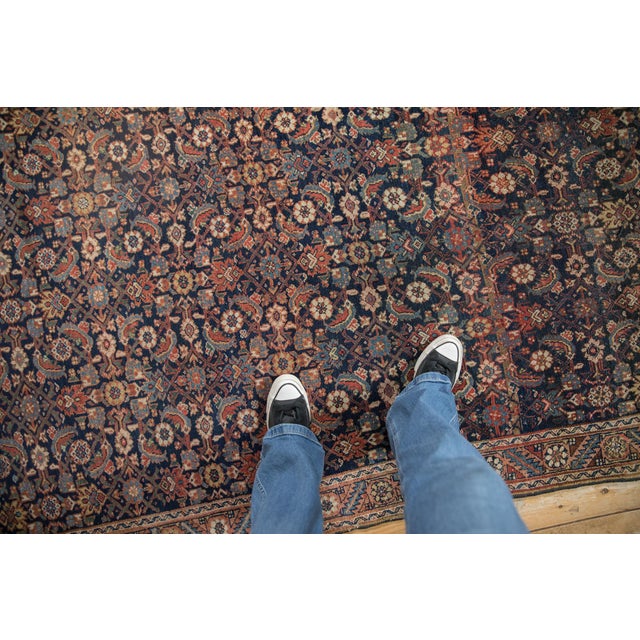 :: Intricate covered field in a Herati motif wrapped by a serrated leaf and floral top view main border and meandering...