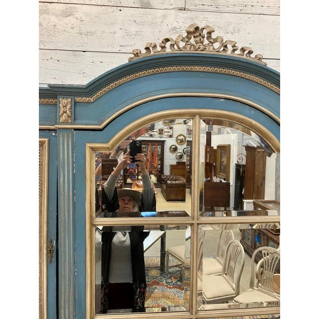 French Provencial Armoire with painted surface of provencial blue with cream accents. The paint appears to be original....