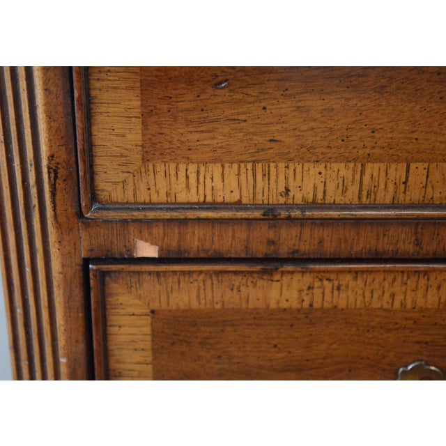 Henredon's impeccable craftmanship shines in this stately chest on chest. Hand rubbed wood boasts Classic brass pulls. A...