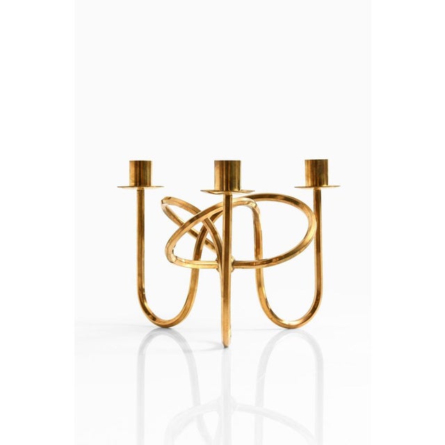 Candlestick (the knot of friendship) in brass designed by Josef Frank. Produced by Svenskt Tenn in Sweden. This piece is...