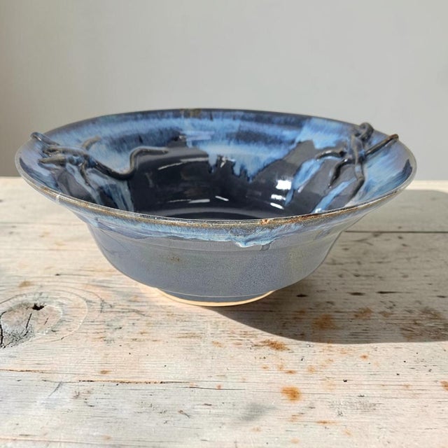 Large signed studio art pottery bowl executed in high-fired stoneware with hand-applied sculptural lizards in relief. The...