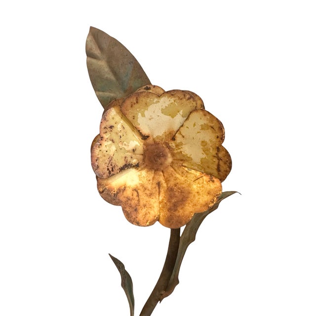 A sweet, vintage tole potted flower. Features a metal flower in pot with a distressed, rustic finish. Intentional...